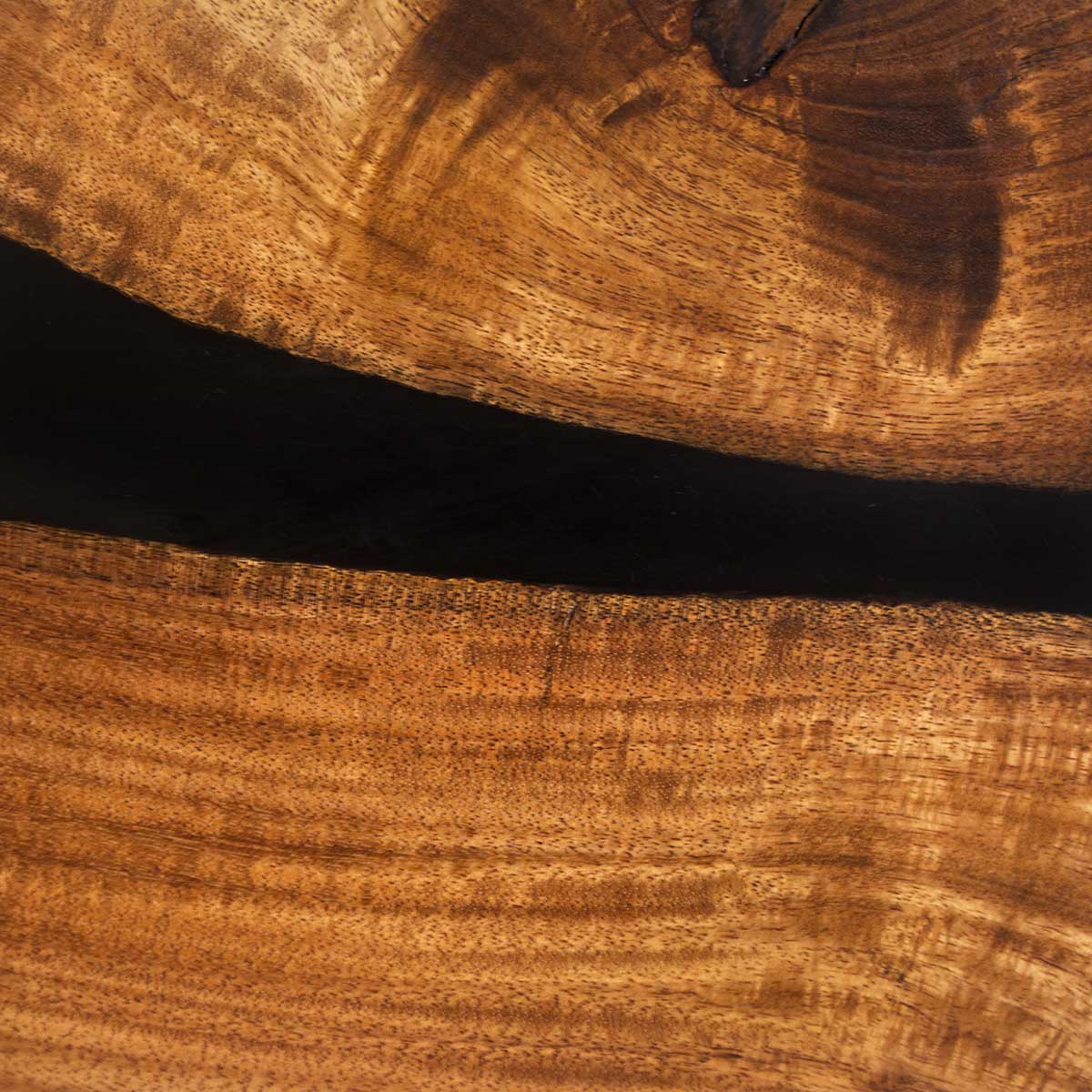 close up acacia wood grain with black epoxy resin