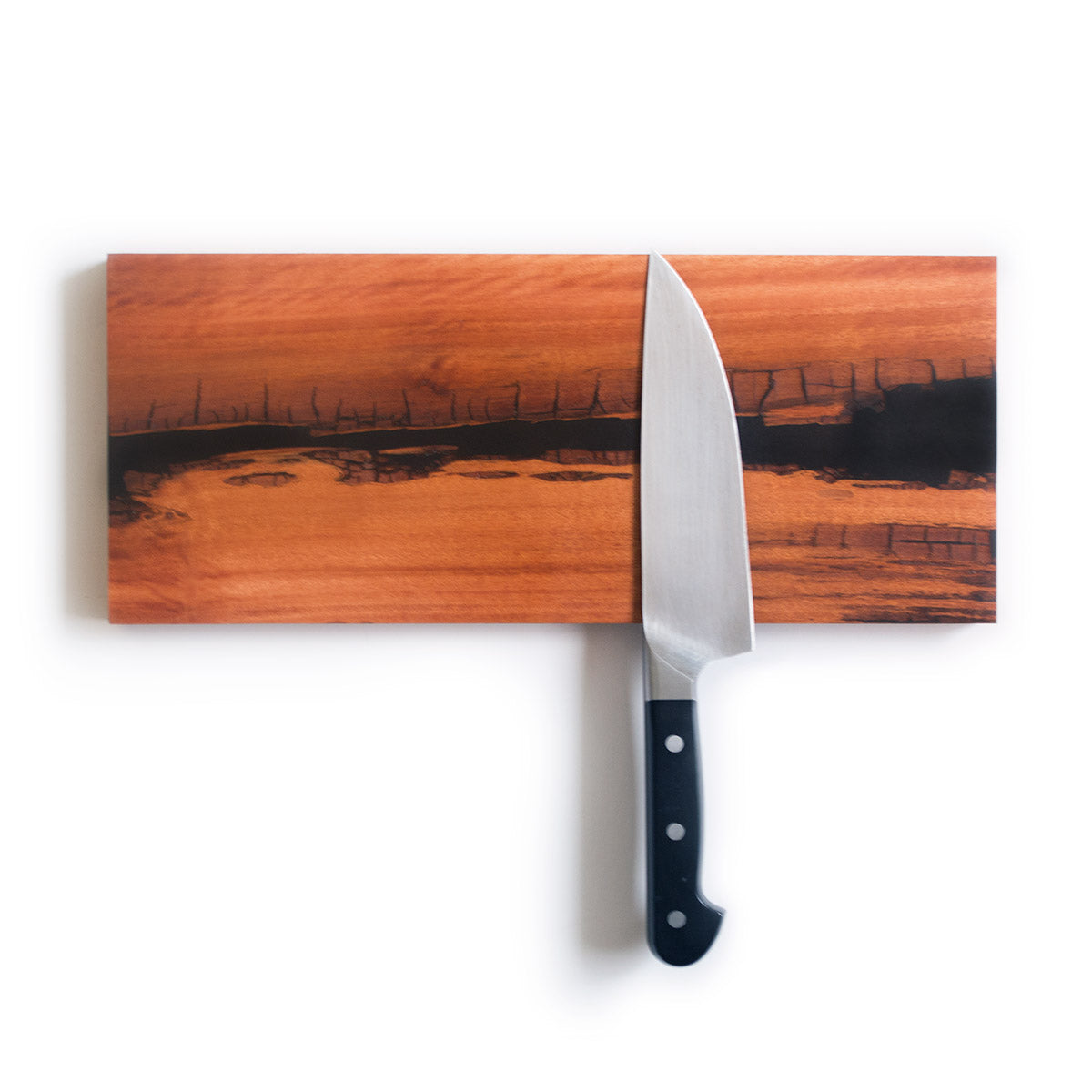 magnetic knife holder made with live edge flamewood hardwood and a black epoxy resin river