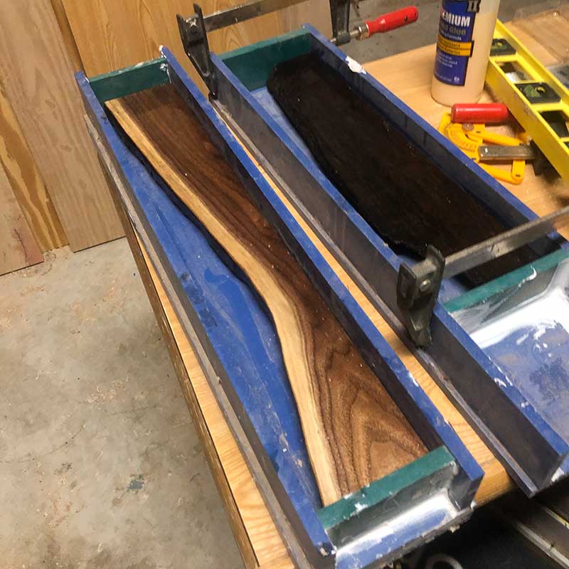 preparing a black walnut live edge piece of hardwood for an epoxy resin pour to make a magnetic knife strip