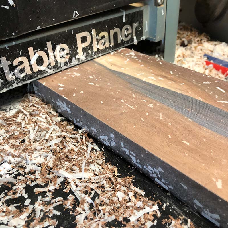benchtop 12 inch planer flattening a walnut hardwood and transparent blue epoxy resin magnetic knife holder for kitchen knives