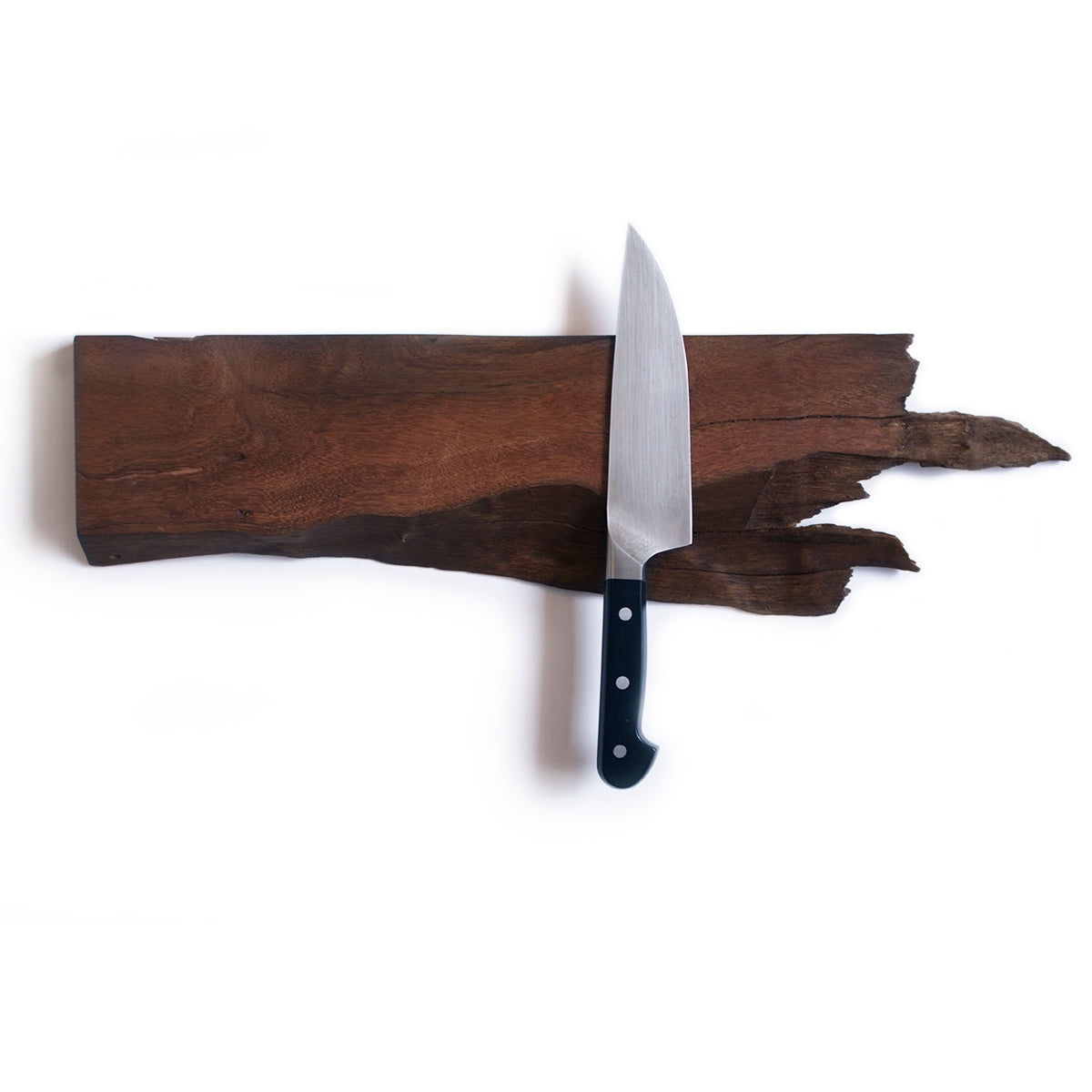 wooden magnetic knife black made with hardwood swamp mahogany wood with a live edge